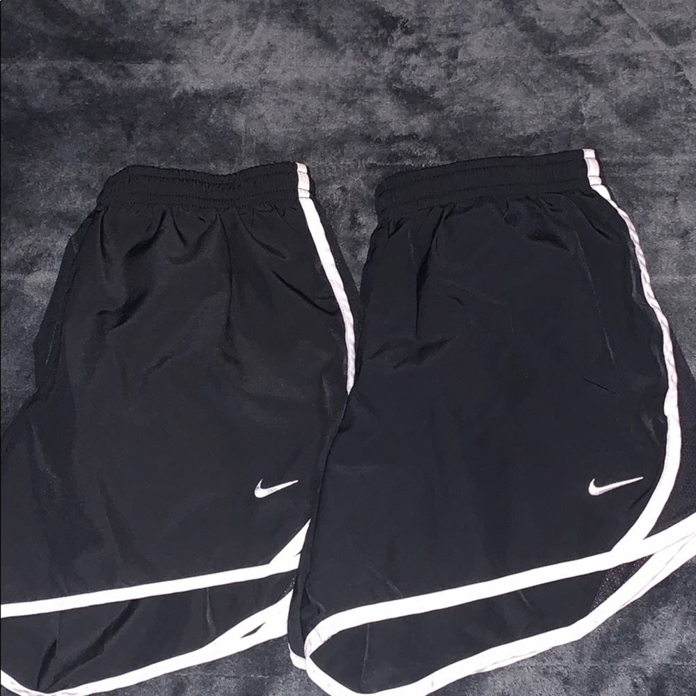 2 pairs of black nike shorts